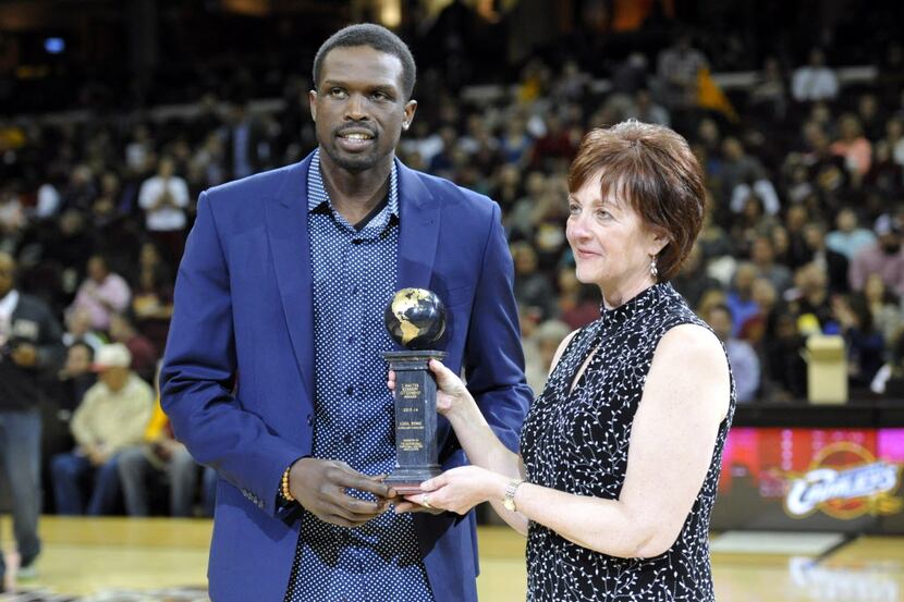Apr 12, 2014; Cleveland, OH, USA; Cleveland Cavaliers forward Luol Deng (left) is presented...