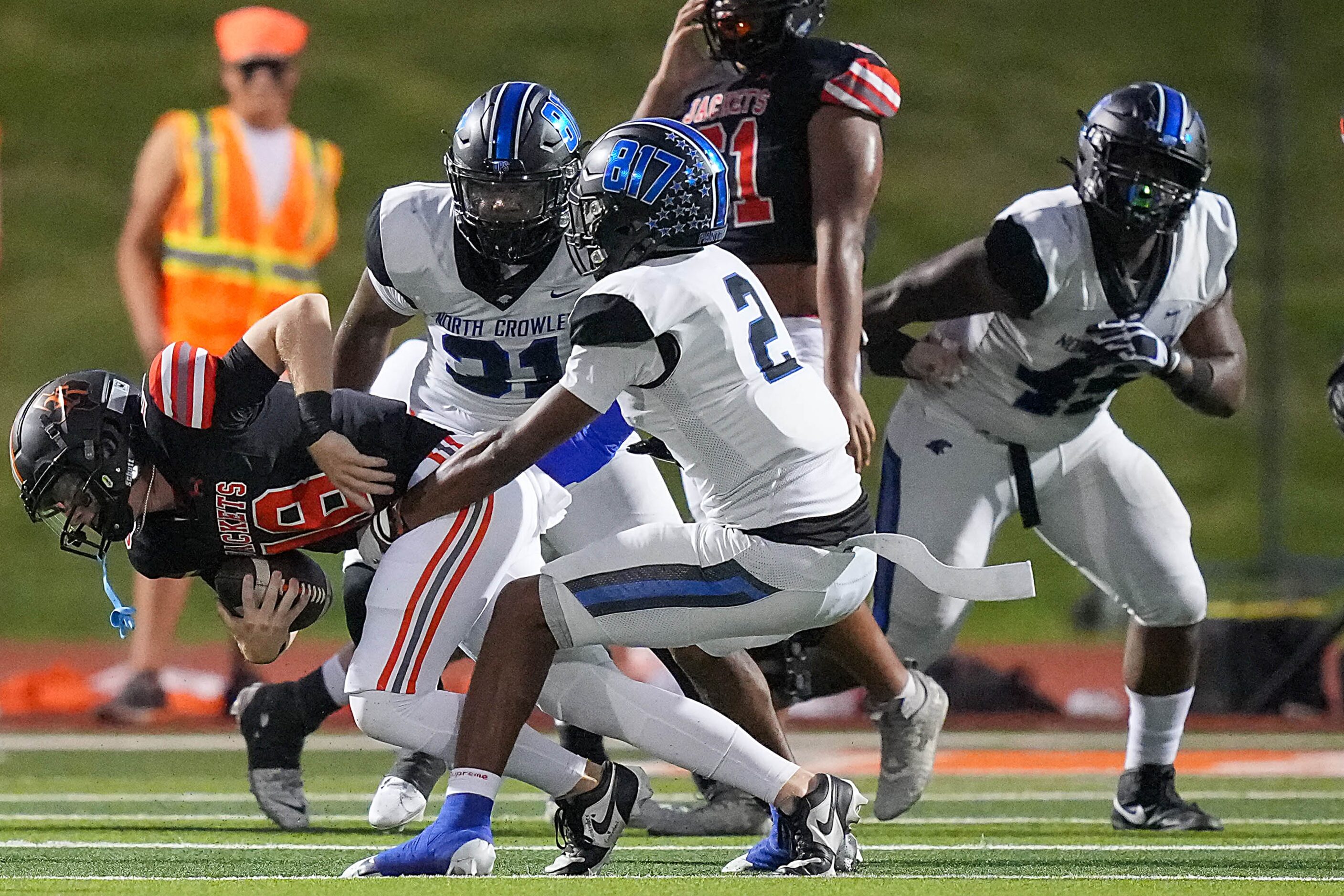 Rockwall quarterback Brent Rickert (18) is sacked by North Crowley linebacker Jonathan...