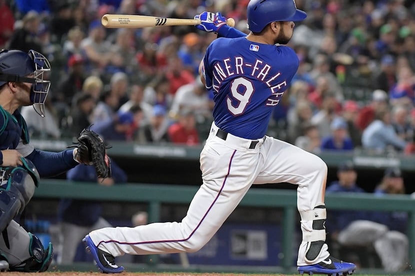 The Texas Rangers' Isiah Kiner-Falefa (9) batting during the fifth inning against the...