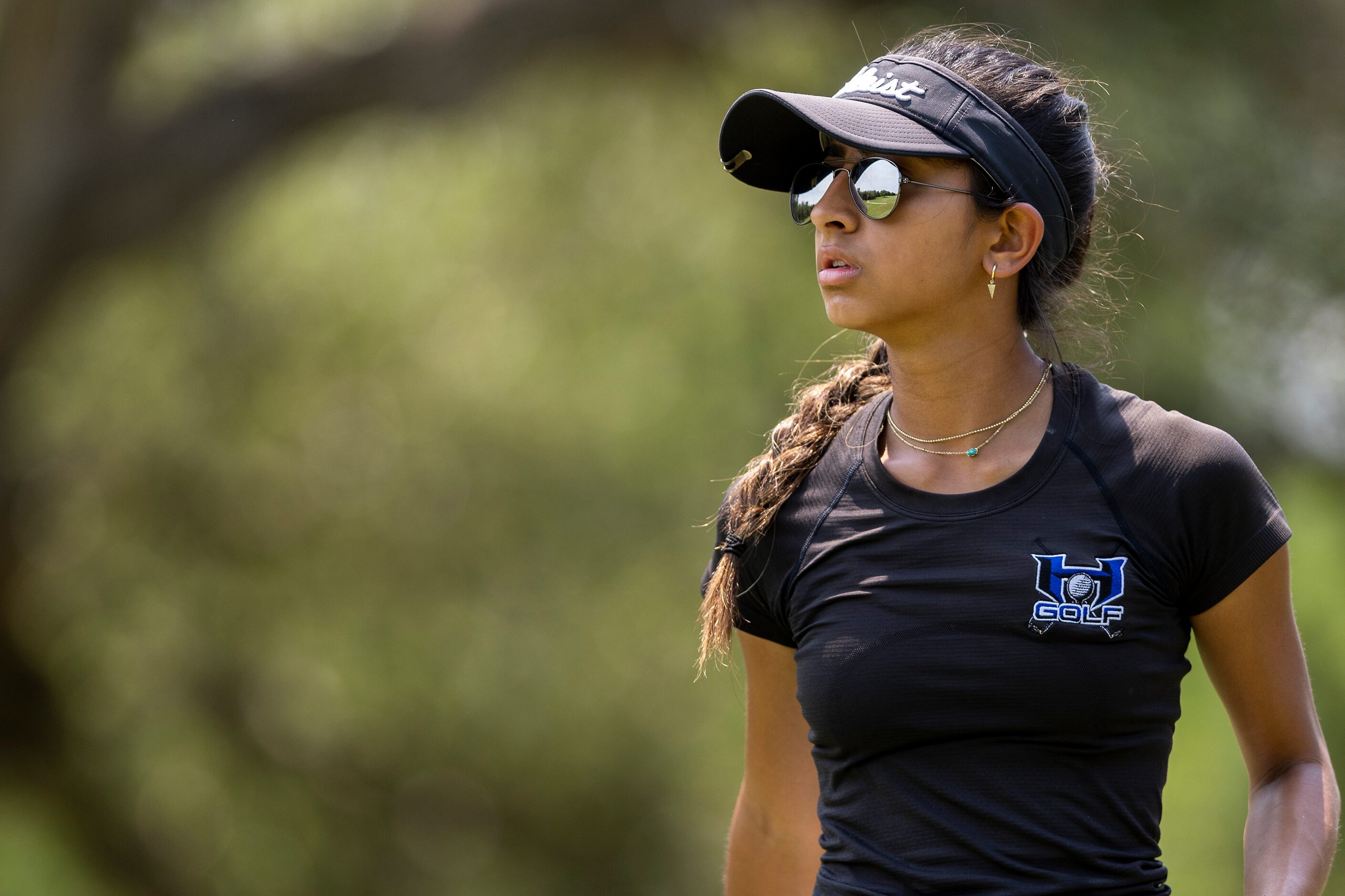 Hebron’s Symran Shah watches her shot from the 9th tee box during the 6A girls state golf...