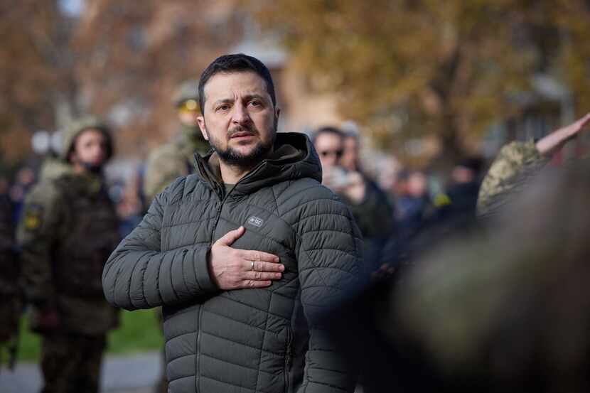 Ukrainian President Volodymyr Zelensky taking part in the flag laying ceremony during his...