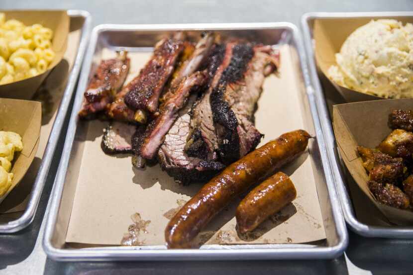 Ribs, brisket and sausage are ready for pickup at Heim Barbecue's new location on Saturday,...