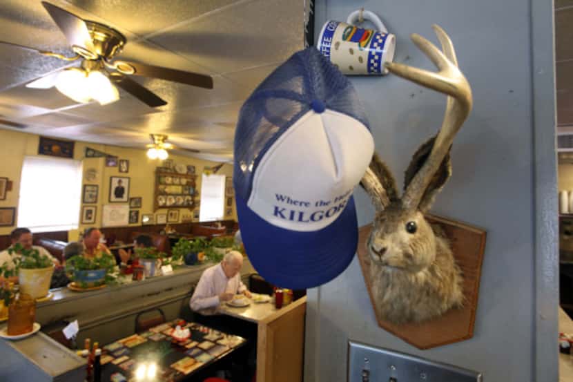 Eclectic decor including a jackalope and a "give me hat" at The Mecca Restaurant in Dallas.