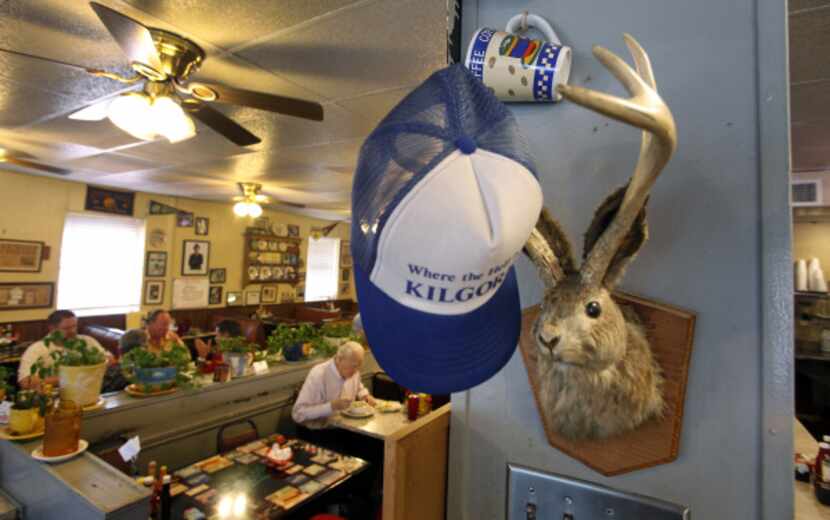 Eclectic decor including a jackalope and a "give me hat" at The Mecca Restaurant in Dallas.