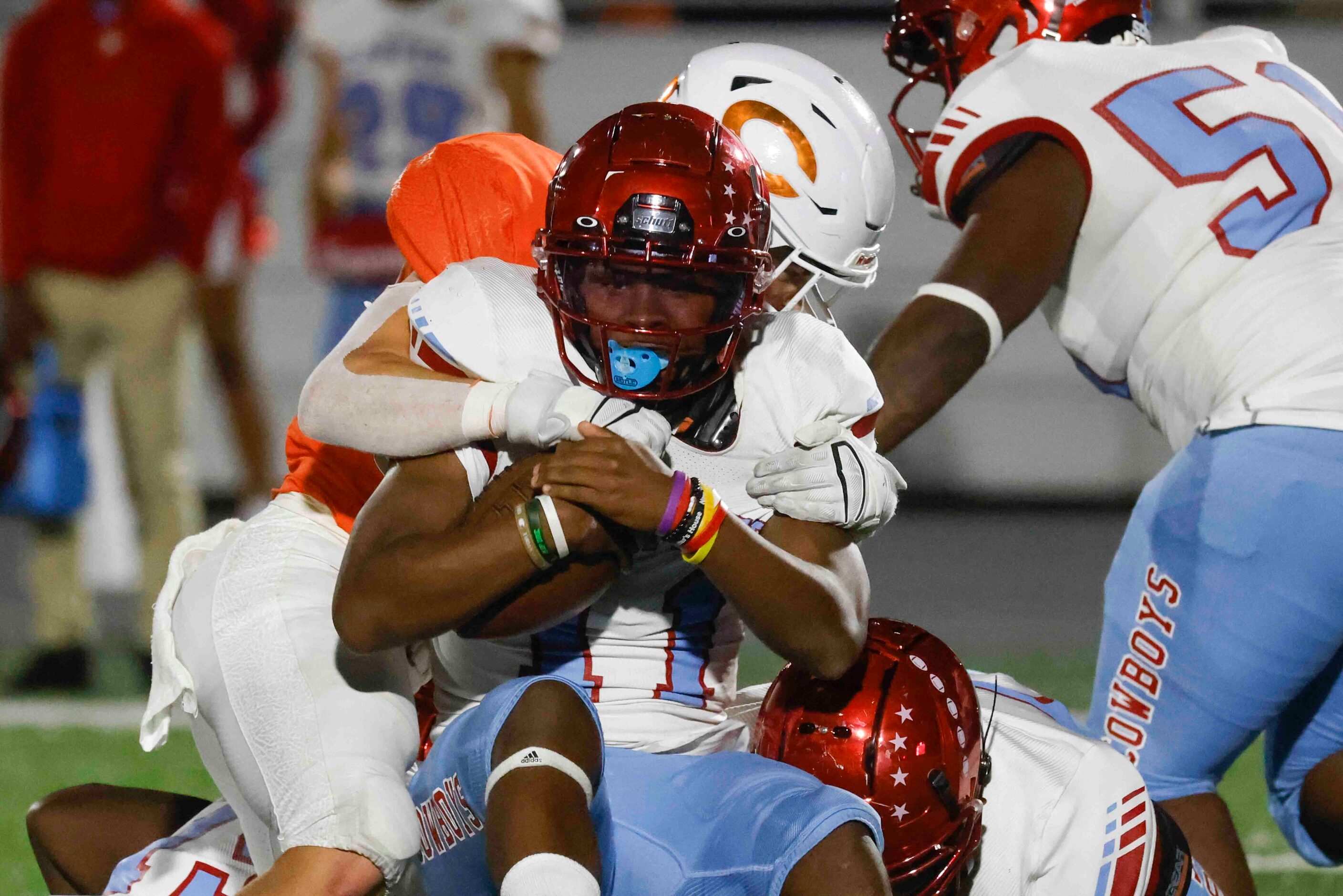 David W. Carter High School’s Camden Patterson (11) gets tackled during the second half of a...