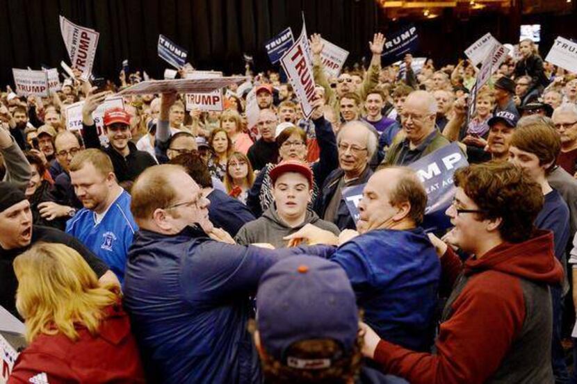 Angry scuffle during a Trump rally. Photo: AP