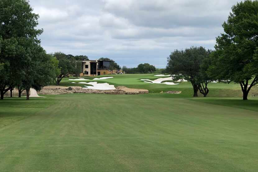 No. 18 at Shady Oaks CC in Fort Worth features a double green with a stream in front and...