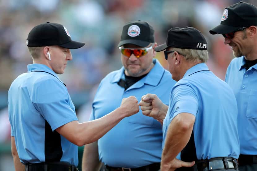 FILE —  Under MLB's new COVID-19 safety rules and guidelines there will be no high-fives, no...
