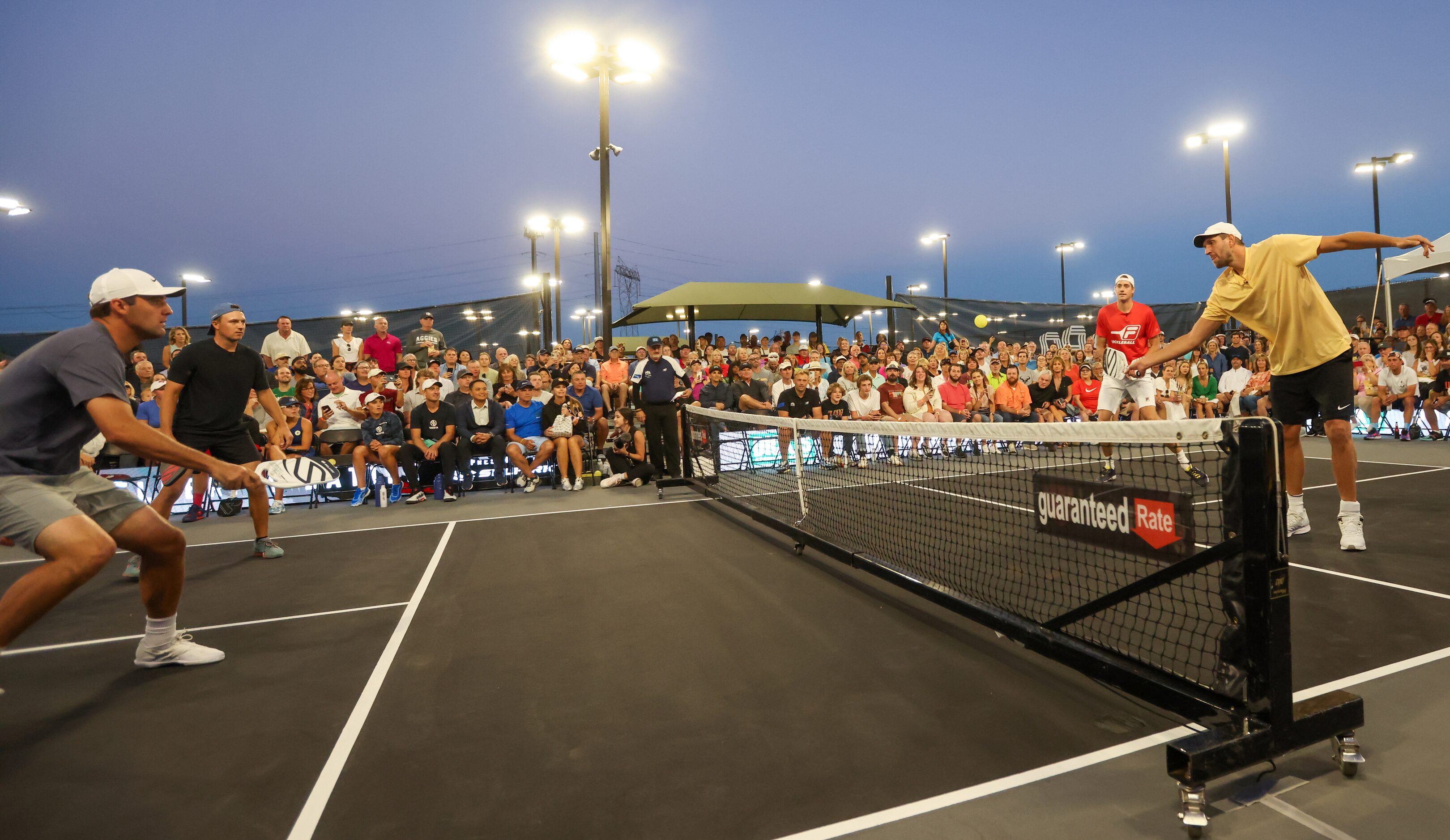 Scottie Scheffler (left to right), Jordan Spieth, John Isner and Dirk Nowitzki play a...