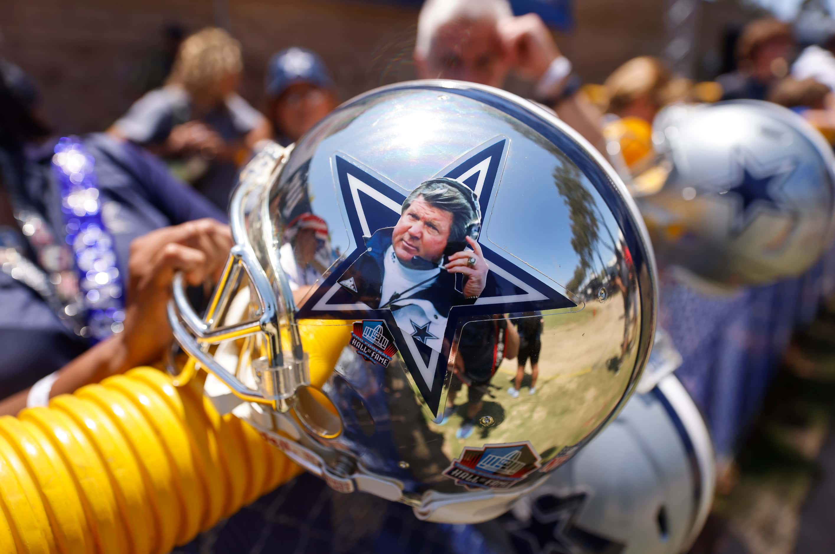 A Dallas Cowboys fan brought a mirrored helmet bearing former head coach Jimmy Johnson’s...