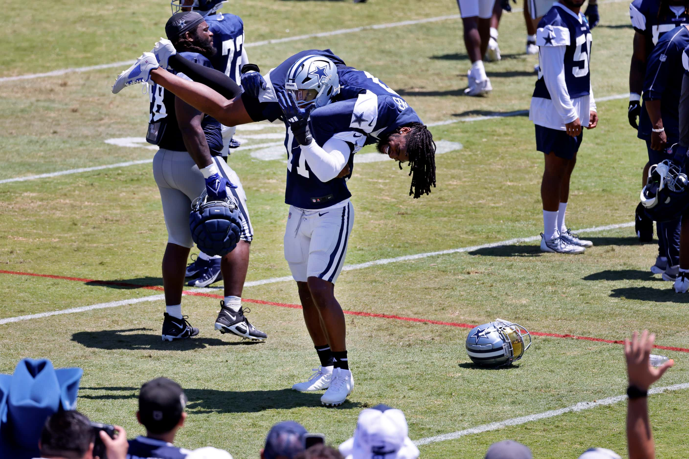 Dallas Cowboys linebacker Micah Parsons (11) encourages the fans to cheer after picking up...