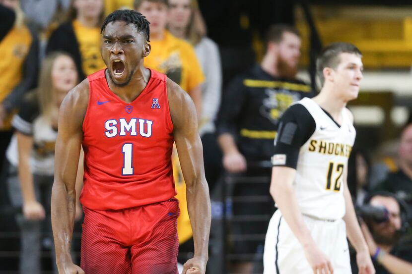 Southern Methodist's Shake Milton (1) celebrates a basket and a foul during the second half...