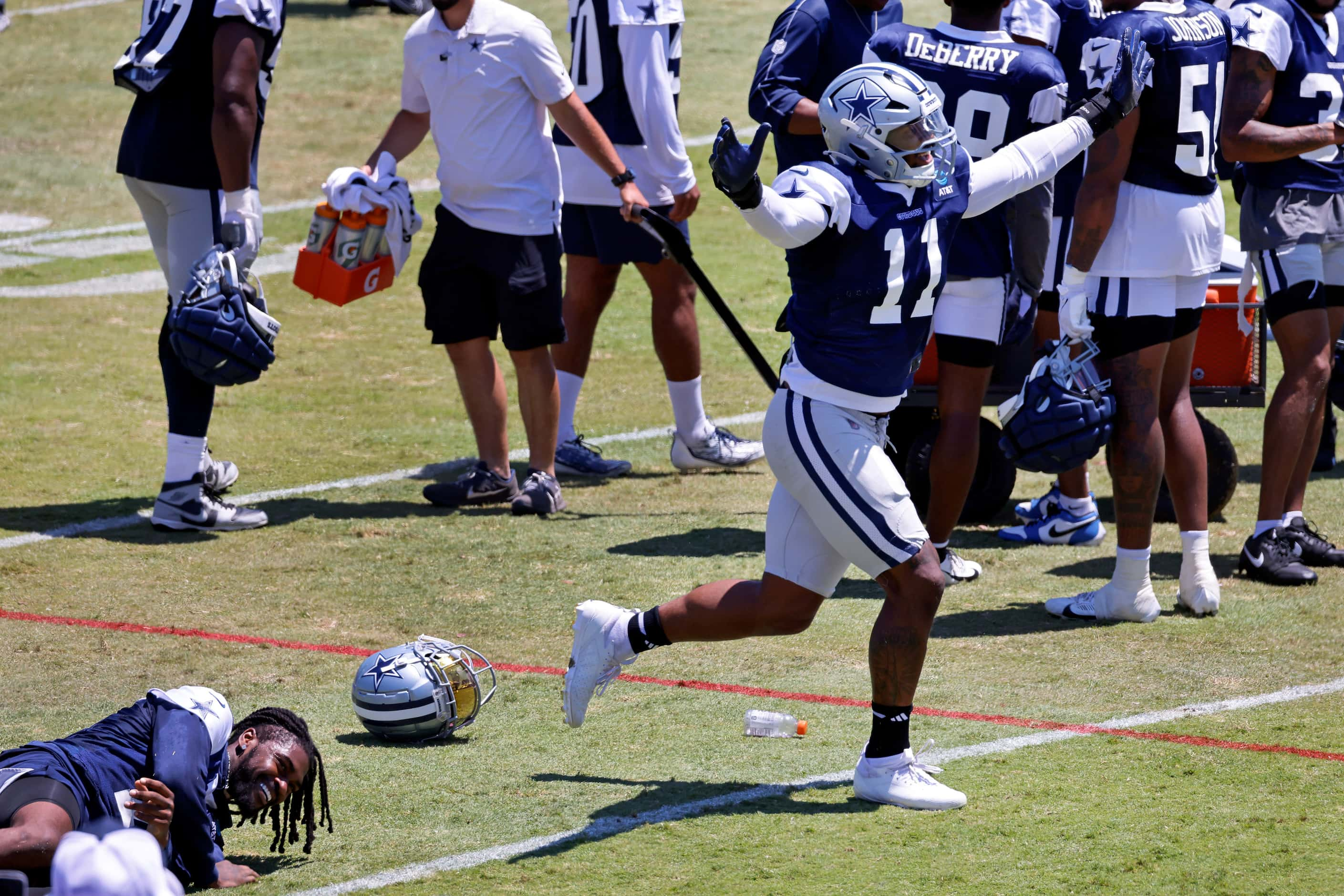 Dallas Cowboys linebacker Micah Parsons (11) celebrates after pinning cornerback Trevon...