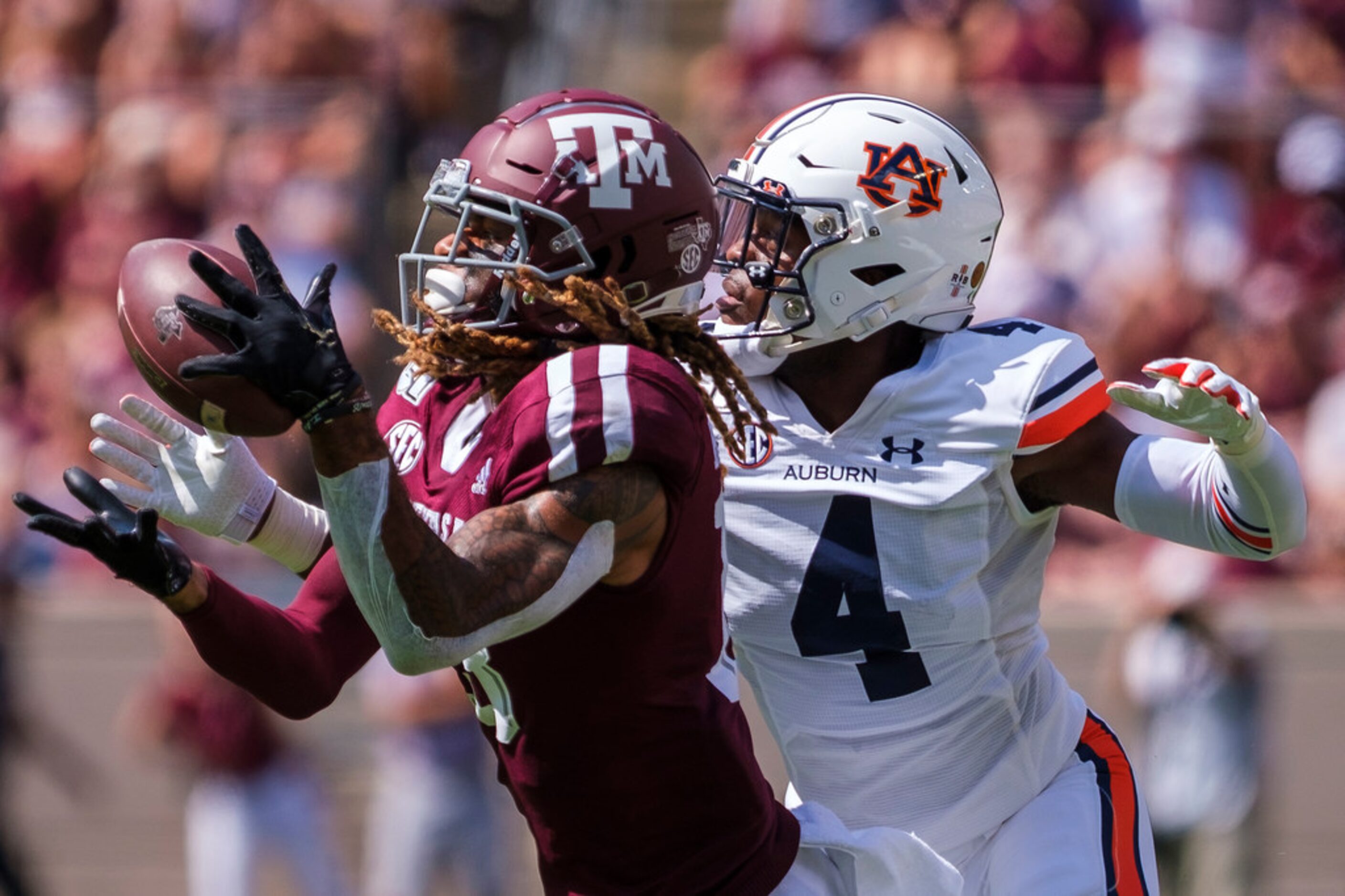 Texas A&M wide receiver Kendrick Rogers (13) has a pass go off his hands as Auburn defensive...