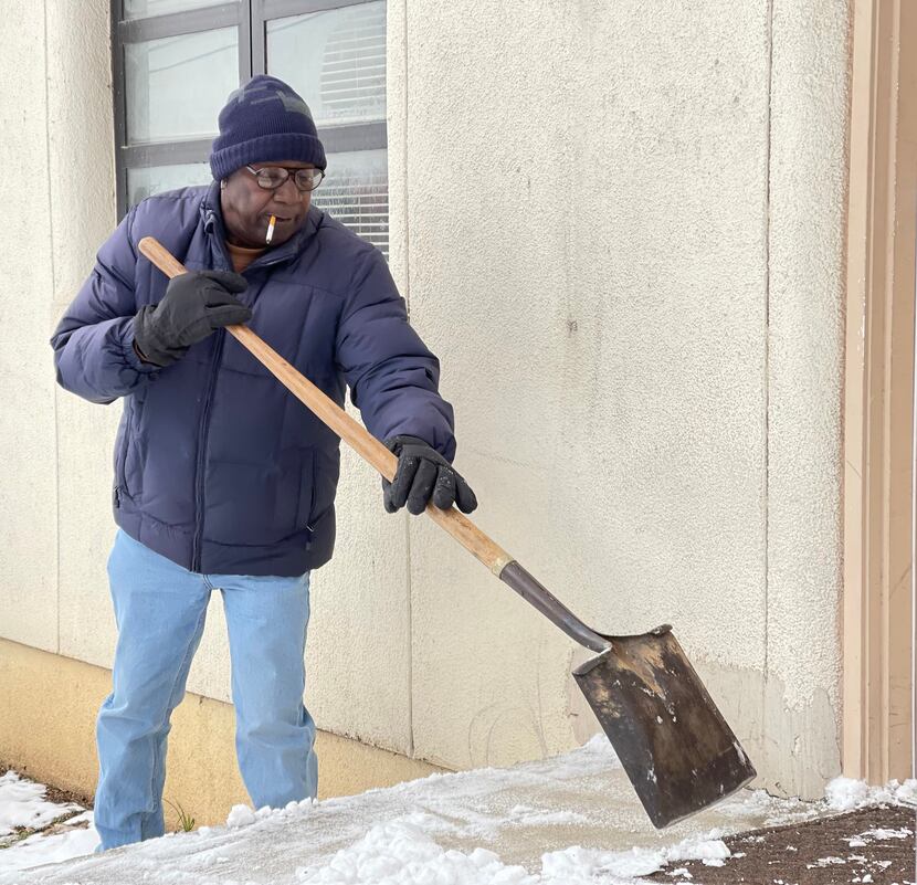 Donald Williams shoveled snow outside his apartment Tuesday, February 16, 2021 in Dallas....