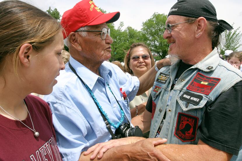 WWII vet Wilfred E. Billey is greeted by Ward Eysaman, a Vietnam veteran from Cherry Point,...