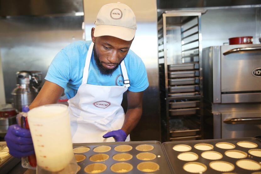 Valery Jean-Bart prepares a cheesecake cupcake in the kitchen of his Greenville Avenue Val's...