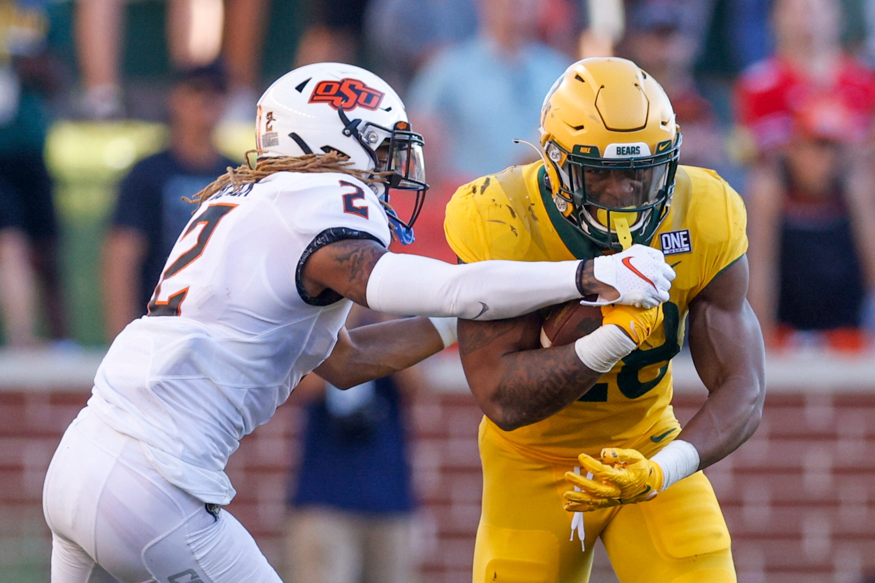 Oklahoma State cornerback Korie Black (2) tackles Baylor running back Qualan Jones (28)...