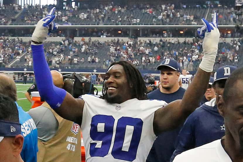 Dallas Cowboys defensive end Demarcus Lawrence (90) celebrates the victory after the game...