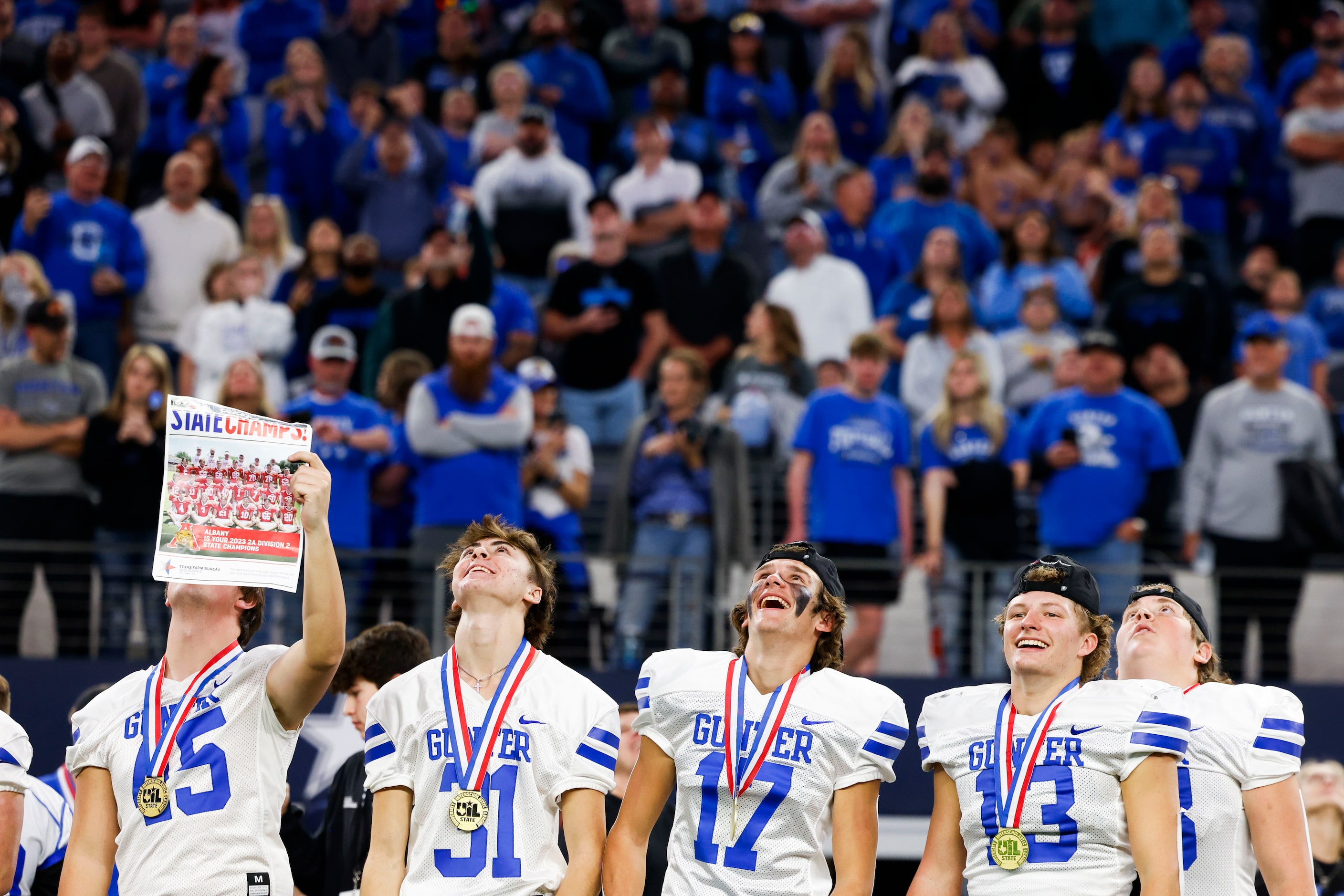 Gunter High players celebrate after winning the Class 3A Division II state championship game...