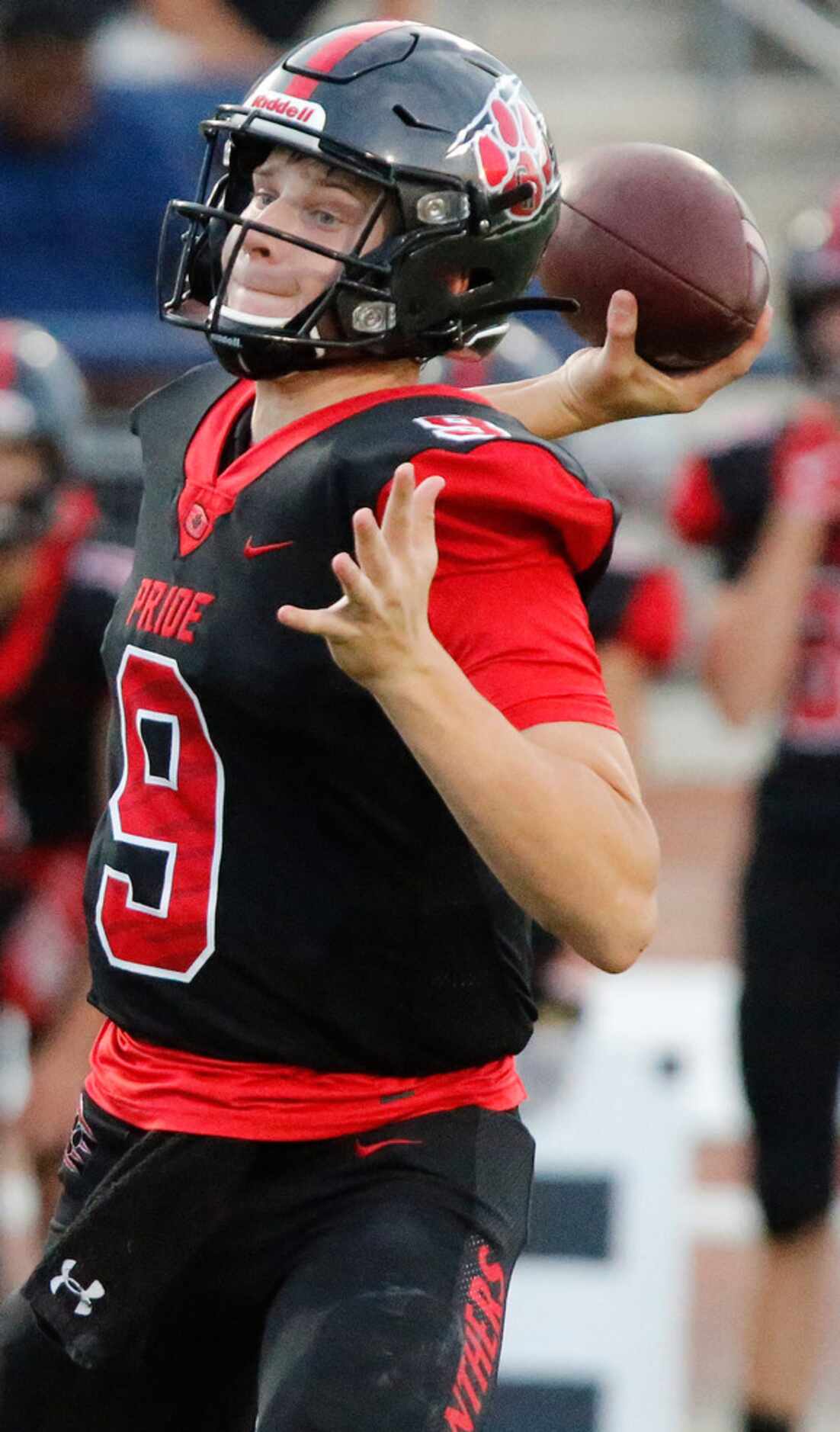 Colleyville Heritage High School quarterback AJ Smith (9) throws a pass during the first...