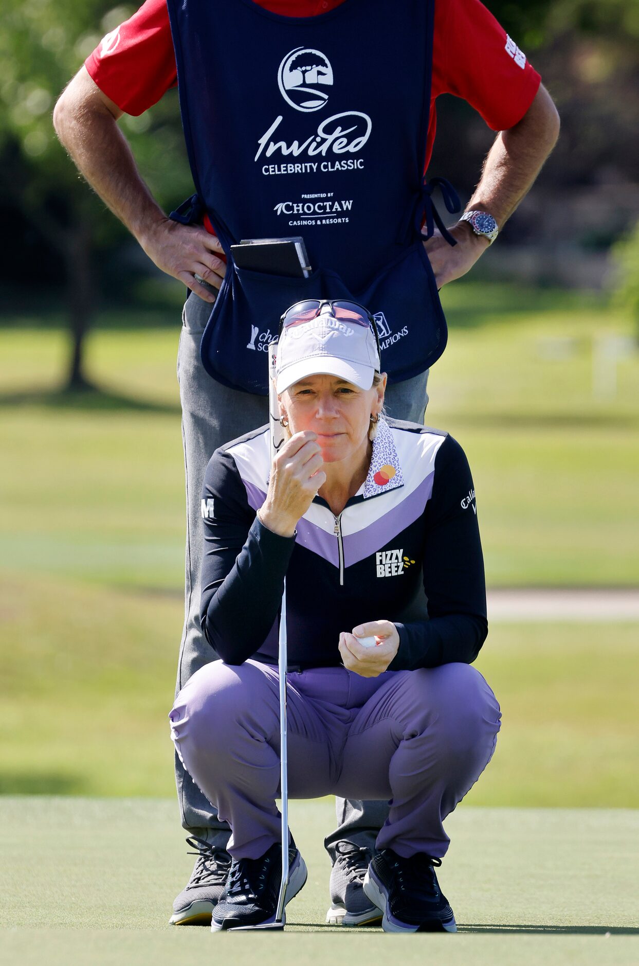 Retired LPGA golfer Annika Sorenstam studies her putt on the No. 8 green during the Invited...