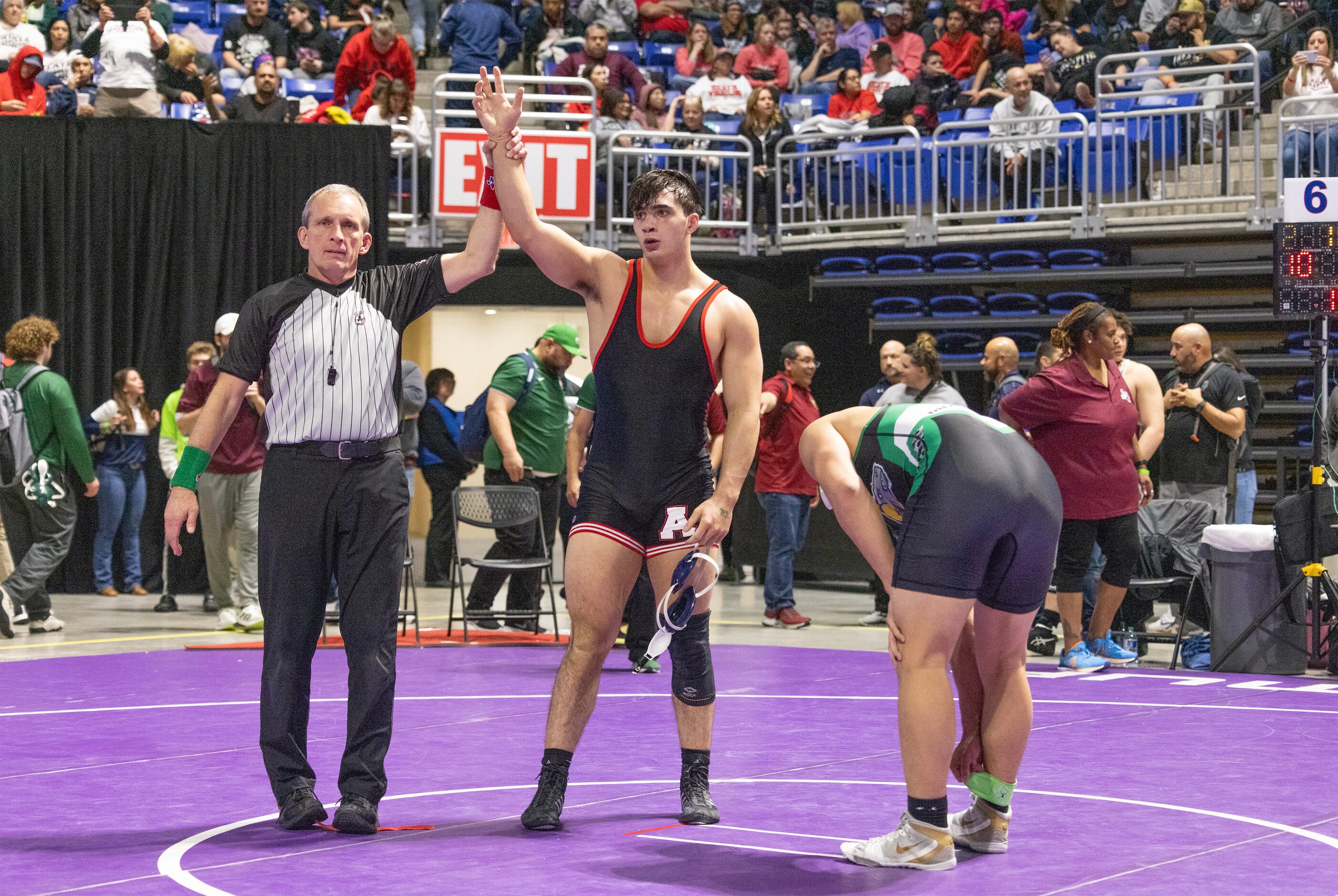 Ryan Nichols from Allen celebrate his win against Jose Angel Rosales in the 6A boys 215...