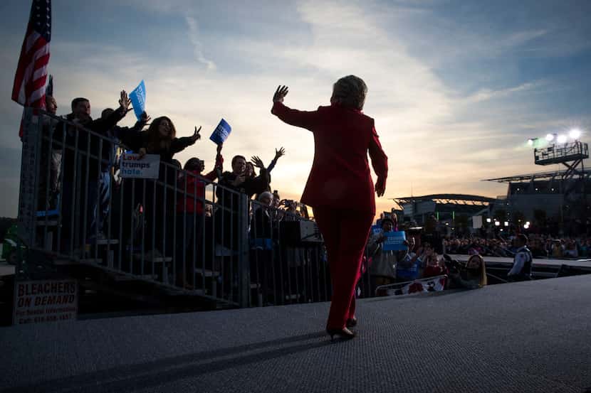Hillary Clinton waves to supporters at a campaign rally where former congresswoman Gabrielle...