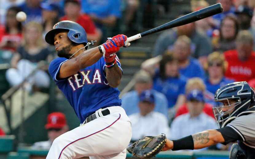 FILE - Texas Rangers center fielder Delino DeShields (3) fouls off a pitch during the New...