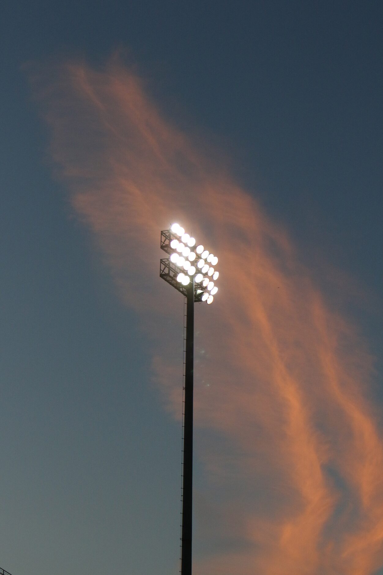 The sun sets behind the Friday Night Lights at Kincaide Stadium during the first quarter of...