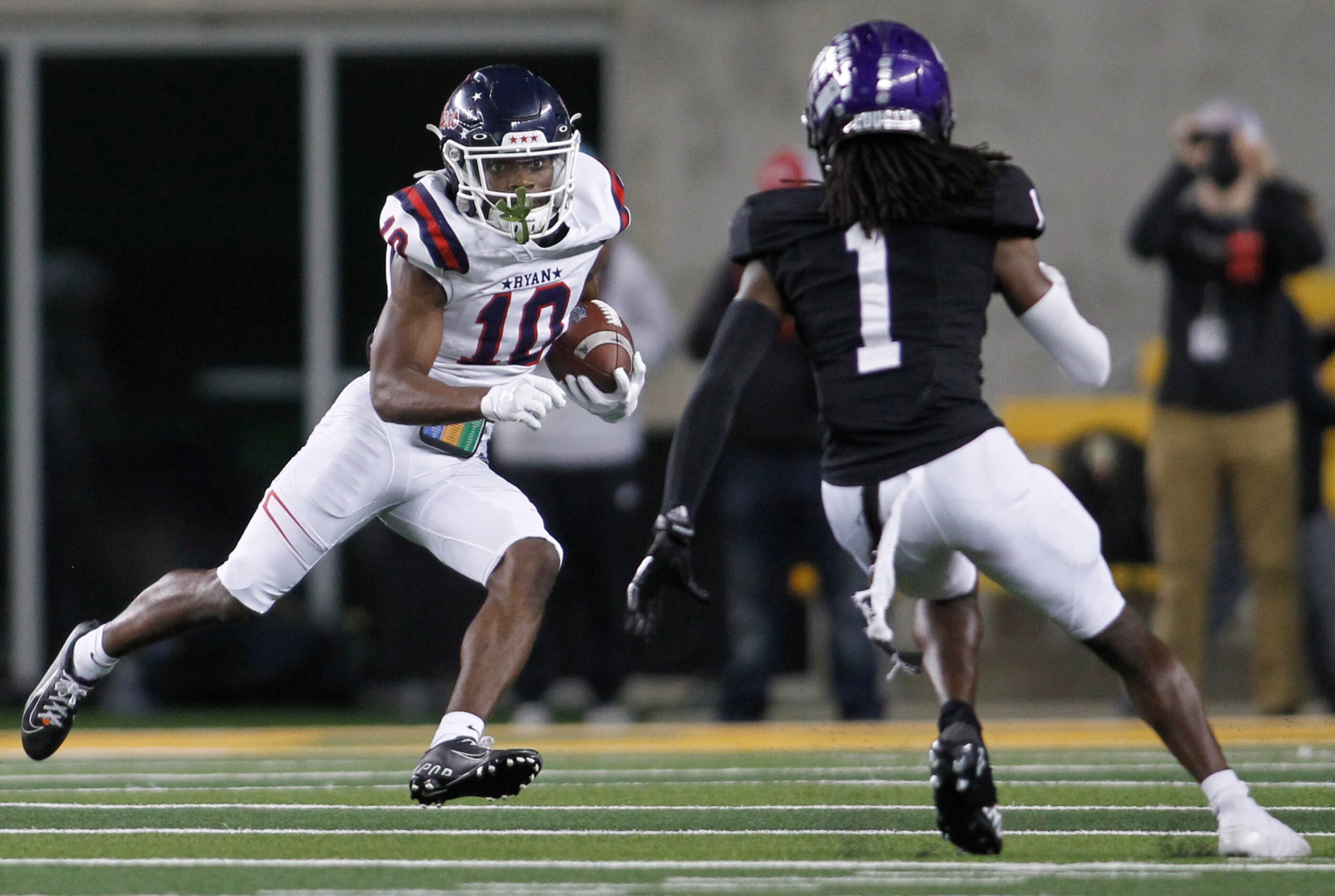 Denton Ryan receiver Antonio Thomas (10) eyes the defense of College Station defensive back...