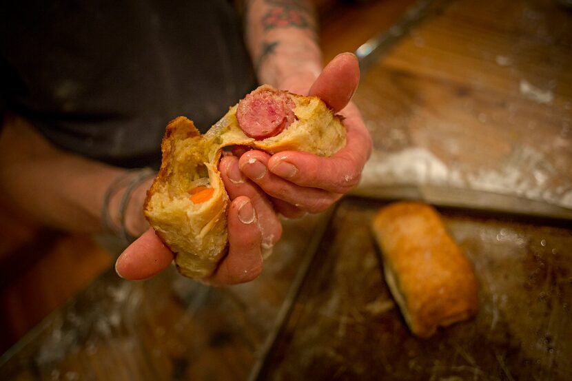 Katherine Clapner breaks open a freshly baked kolache Friday, February 5, 2016 in Dallas. 