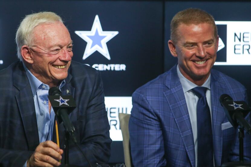 Dallas Cowboys owner Jerry Jones, left, and head coach Jason Garrett laugh at a joke by...