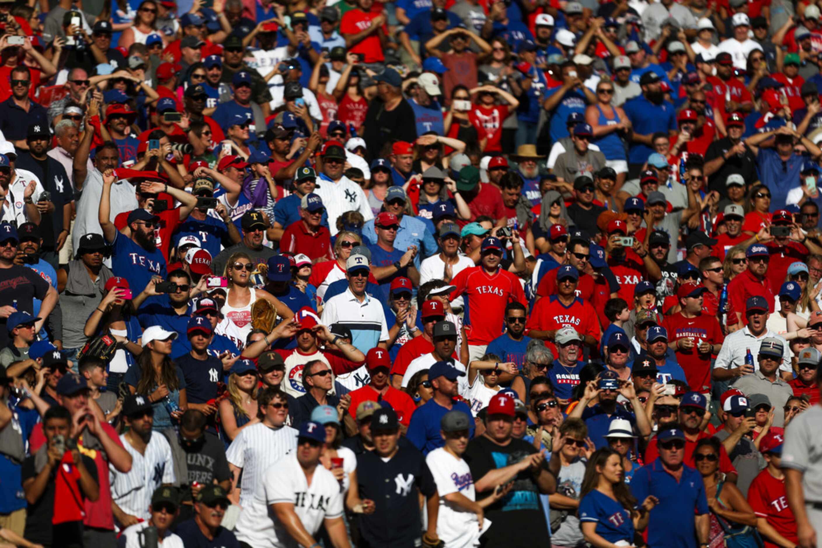 Fans watch the Texas Rangers play the New York Yankees on Sunday, September 29, 2019 at...