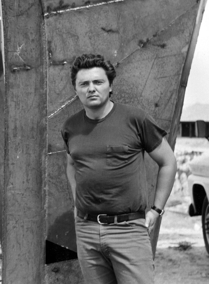 Robert Bruno stands next to his construction of the Steel House in Ransom Canyon, a...