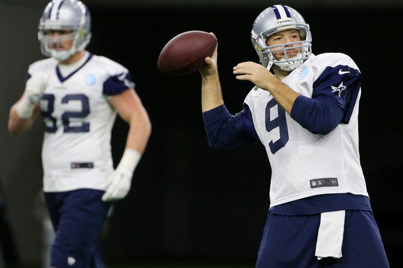 Dallas Cowboys quarterback Tony Romo (9) throws the ball during team practice at The Star in...