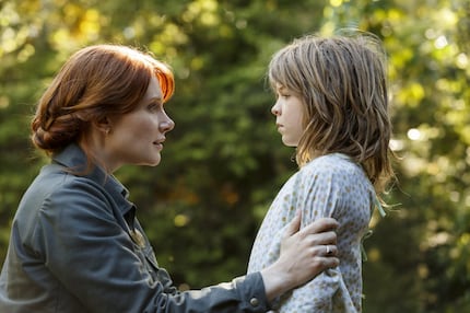 This image released by Disney shows Bryce Dallas Howard, left, and Oakes Fegley in a scene...
