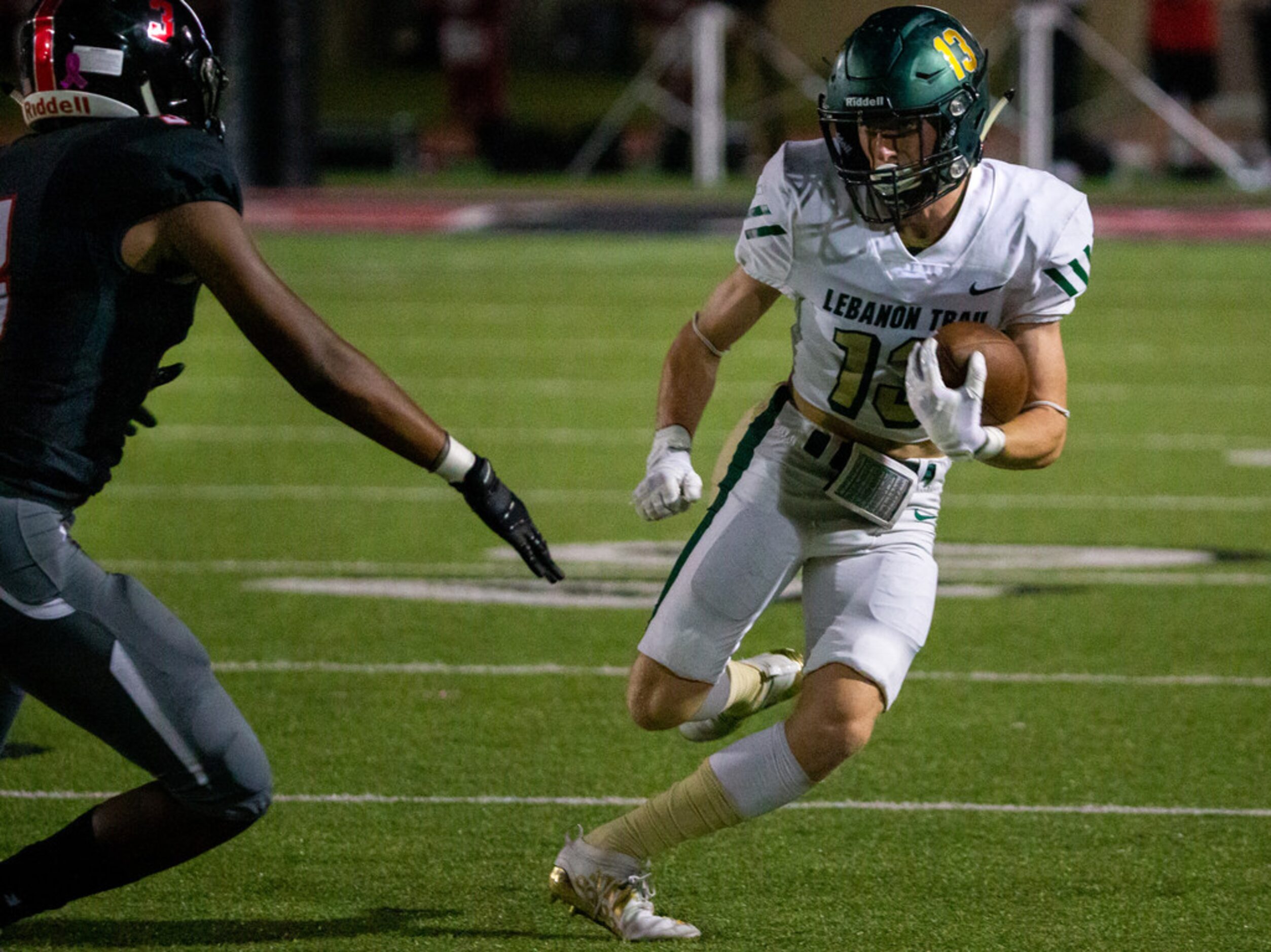 Lebanon Trail wide receiver Jason O'Brien (13) attempts to run a pass during the football...