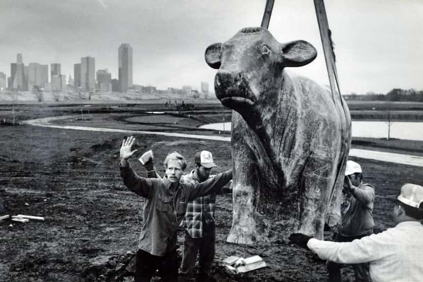 
Dallas sculptor Harold F. Clayton (left, with arms raised) directed the proceedings as a...