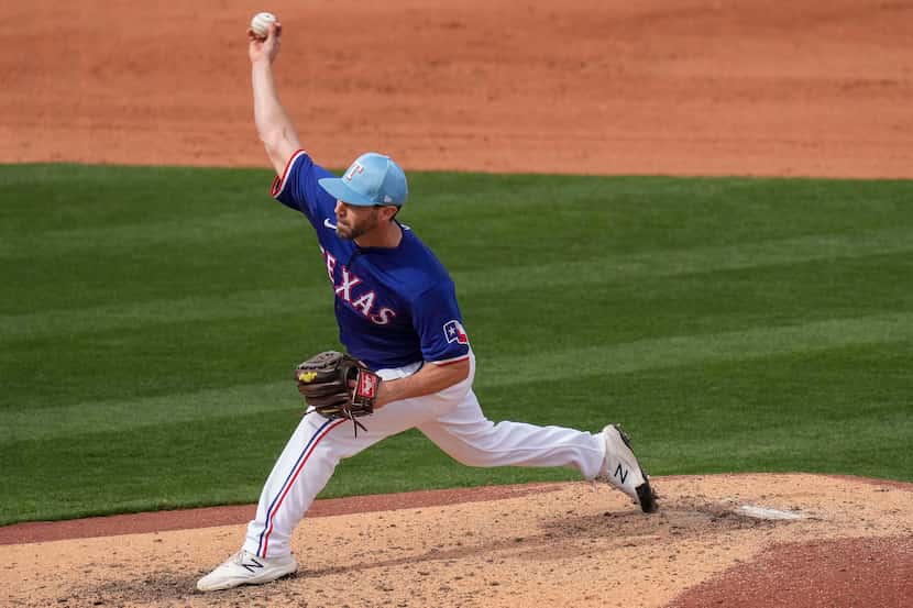 Texas Rangers pitcher Austin Pruitt delivers during the seventh inning of a spring training...