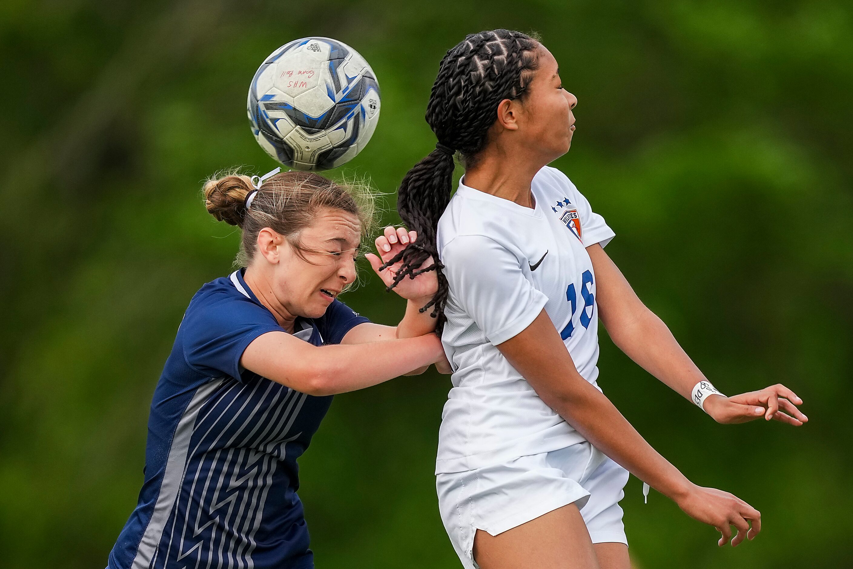 Prosper Walnut Grove defender Averi Scruggs (left) challenges Frisco Wakeland’s Morgan...