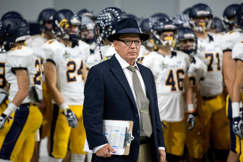 Highland Park head coach Randy Allen surveys the field before his team takes the field...