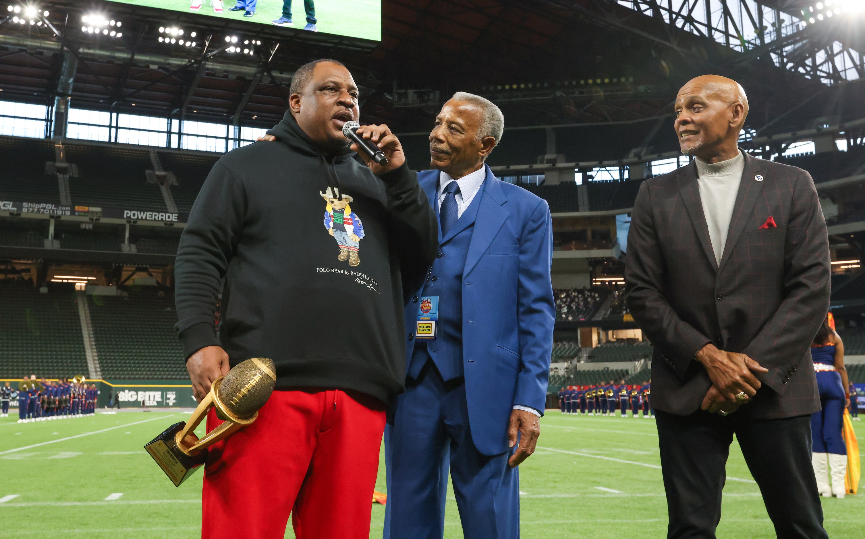 South Oak Cliff head coach Jason Todd (left) speaks next to Hiawatha Williams and Roland...