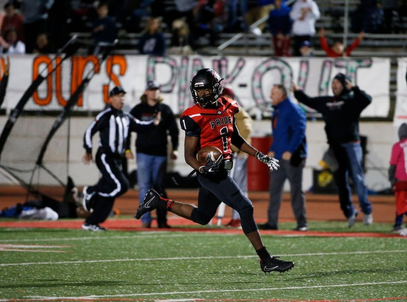 Colleyville Heritage receiver Ke'von Ahmad (1) grabs an 85-yard touchdown catch as he...