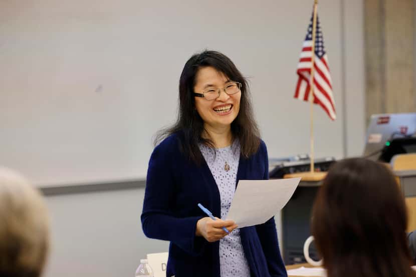 Daisy Xiao provides feedback on a speech at a Texas Dragon Toastmasters Club meeting at the...