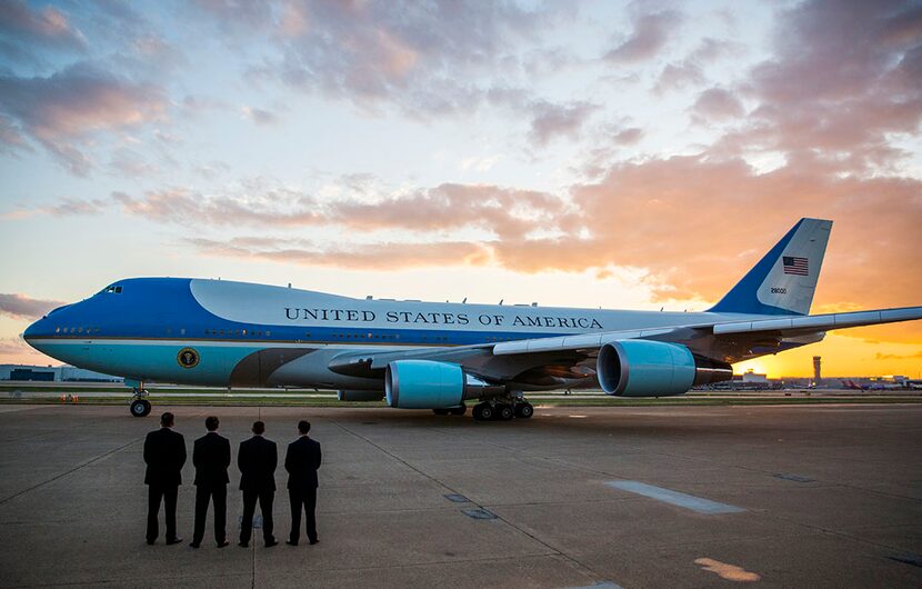  Secret Service agents stand by while Air Force One departs Dallas from Dalfort Fueling at...