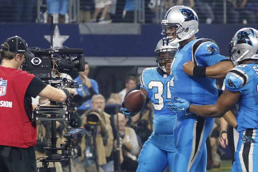 Carolina Panthers quarterback Cam Newton (1) smiles for the camera after scoring a touchdown...