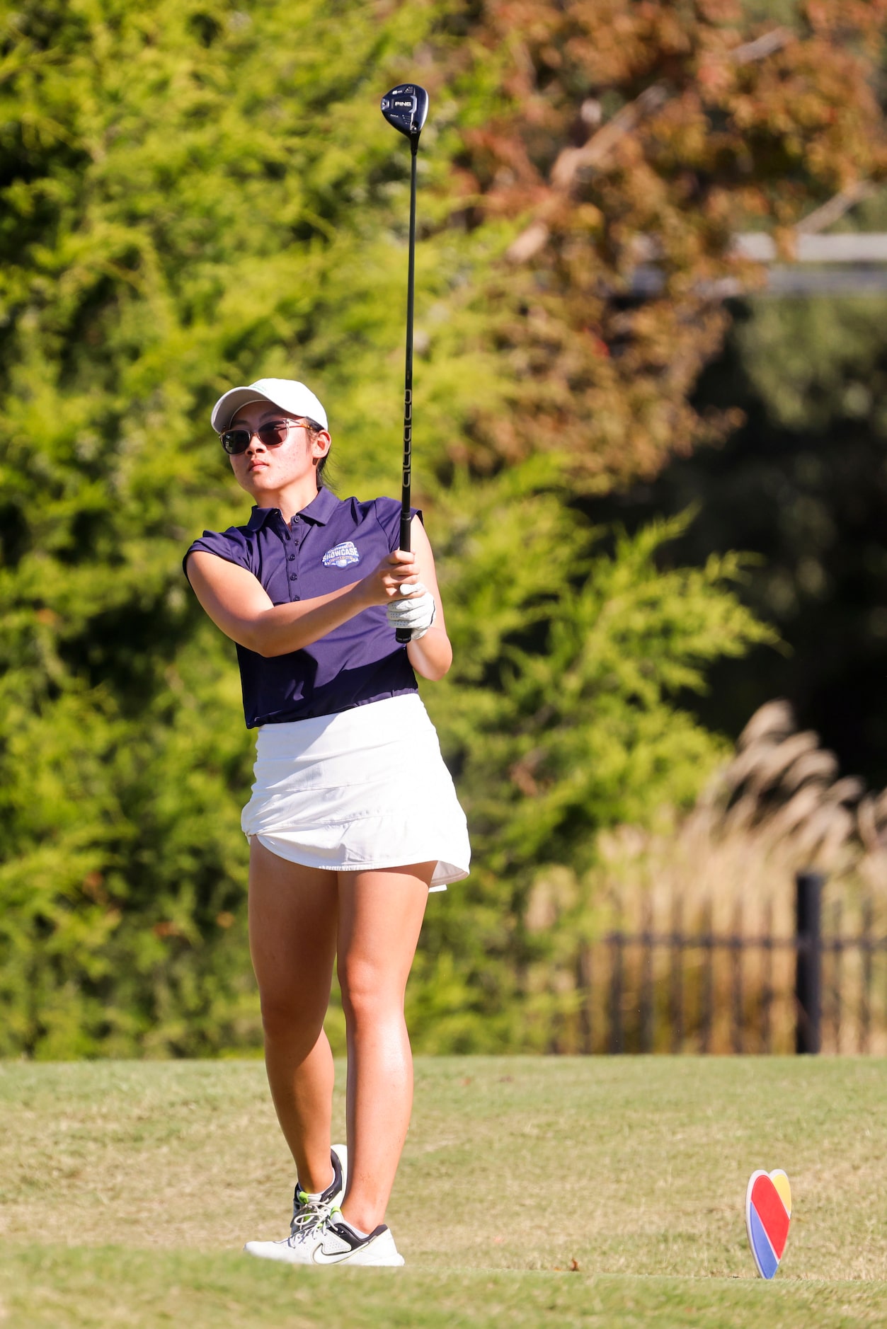 Malisone Chanthapanya of University of North Texas follows after teeing off on the seventh...