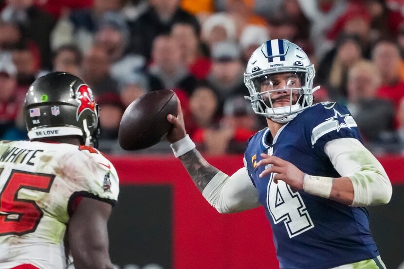 Dallas Cowboys quarterback Dak Prescott (4) throws a pass under pressure from  Tampa Bay...