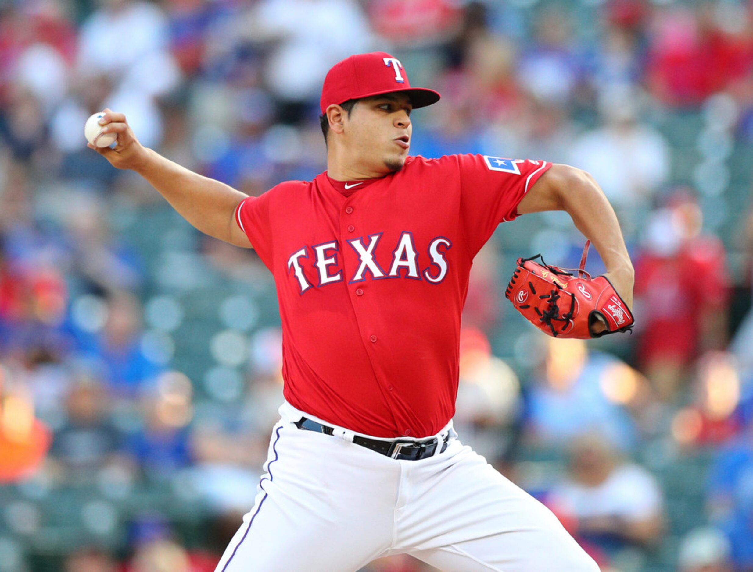 Texas Rangers starting pitcher Ariel Jurado throws to a Baltimore Orioles batter during the...